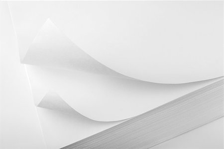 Closeup of paper corner curved and curled on white Stock Photo - Budget Royalty-Free & Subscription, Code: 400-07184830