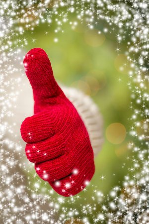 simsearch:400-06462603,k - Woman in Sweater with Seasonal Red Mittens Holding Out a Thumbs Up Sign with Snow Flakes Border. Stock Photo - Budget Royalty-Free & Subscription, Code: 400-07184853