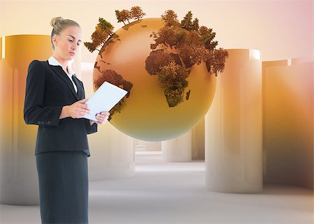 female business woman holding ball - Composite image of blonde businesswoman holding new tablet Stock Photo - Budget Royalty-Free & Subscription, Code: 400-07186125