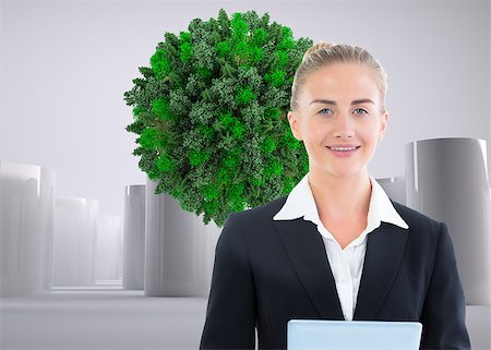 female business woman holding ball - Composite image of blonde businesswoman holding tablet Stock Photo - Budget Royalty-Free & Subscription, Code: 400-07186624