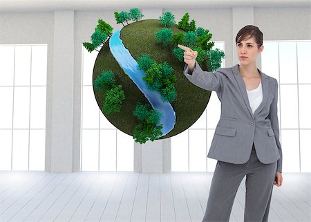 Composite image of young businesswoman pointing to something Stock Photo - Budget Royalty-Free & Subscription, Code: 400-07186653