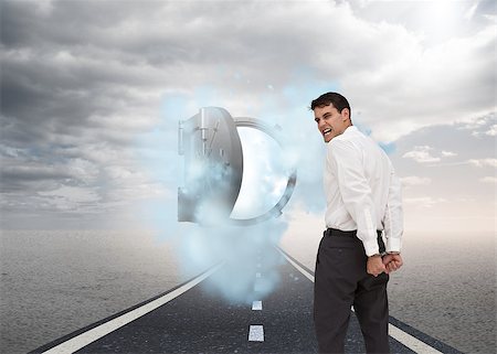 Composite image of rear view of young businessman wearing handcuffs Stock Photo - Budget Royalty-Free & Subscription, Code: 400-07186846