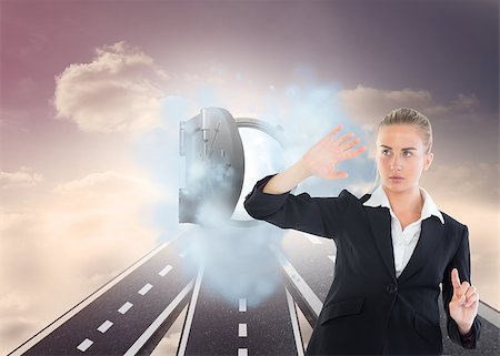 Composite image of blonde businesswoman pointing somewhere Stock Photo - Budget Royalty-Free & Subscription, Code: 400-07187039