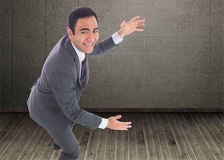 Composite image of excited businessman catching Stock Photo - Budget Royalty-Free & Subscription, Code: 400-07187187