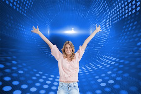 simsearch:400-07345820,k - Composite image of a full length shot of a smiling woman who has her arms raised up Stock Photo - Budget Royalty-Free & Subscription, Code: 400-07188001