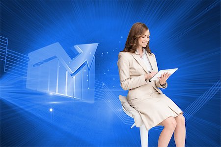 Composite image of happy brunette businesswoman using tablet Stock Photo - Budget Royalty-Free & Subscription, Code: 400-07188053