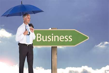 Composite image of happy mature businessman holding umbrella Stock Photo - Budget Royalty-Free & Subscription, Code: 400-07188088