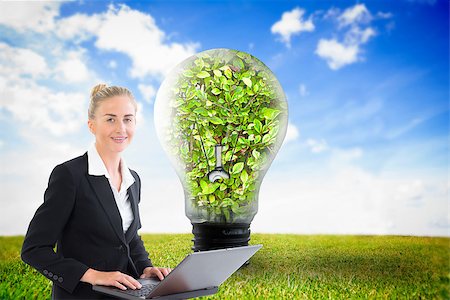 simsearch:400-07220226,k - Composite image of blonde businesswoman using laptop Stockbilder - Microstock & Abonnement, Bildnummer: 400-07188151