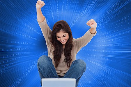 simsearch:400-07189587,k - Composite image of pretty brunette cheering while using laptop Stockbilder - Microstock & Abonnement, Bildnummer: 400-07188321