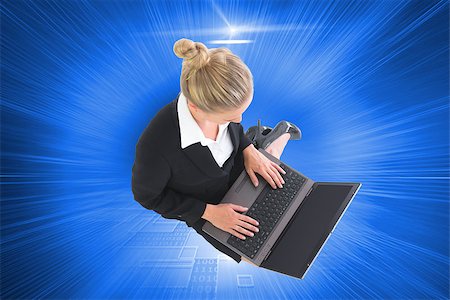 simsearch:400-07188518,k - Composite image of blonde businesswoman using laptop Foto de stock - Royalty-Free Super Valor e Assinatura, Número: 400-07188334