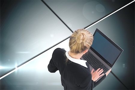 simsearch:400-07188518,k - Composite image of blonde businesswoman using laptop Foto de stock - Royalty-Free Super Valor e Assinatura, Número: 400-07188518