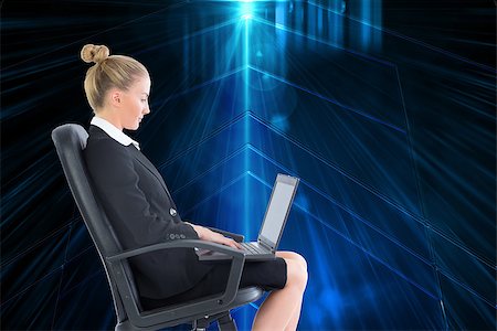 simsearch:400-07188518,k - Composite image of blonde businesswoman sitting on swivel chair with laptop Foto de stock - Royalty-Free Super Valor e Assinatura, Número: 400-07188523