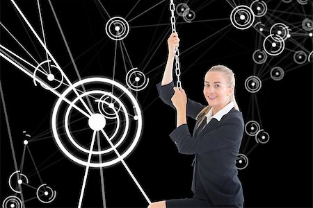 simsearch:400-07224720,k - Composite image of blonde businesswoman pulling a chain Stock Photo - Budget Royalty-Free & Subscription, Code: 400-07188556