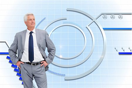 simsearch:400-07189733,k - Composite image of man in a suit with his hands on his hips Stock Photo - Budget Royalty-Free & Subscription, Code: 400-07188588