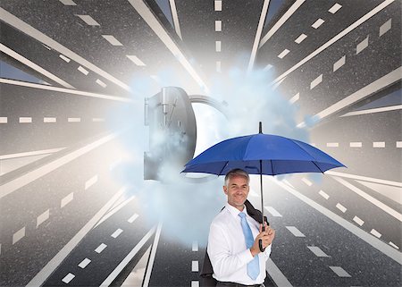 Composite image of businessman holding umbrella smiling at camera Stock Photo - Budget Royalty-Free & Subscription, Code: 400-07188603