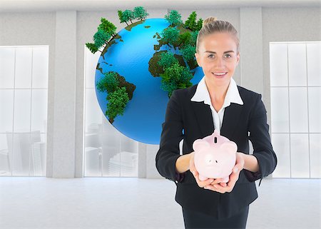 female business woman holding ball - Composite image of blonde businesswoman holding pink piggy bank Stock Photo - Budget Royalty-Free & Subscription, Code: 400-07188617