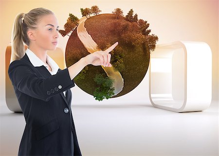 Composite image of blonde businesswoman pointing somewhere Stock Photo - Budget Royalty-Free & Subscription, Code: 400-07188666