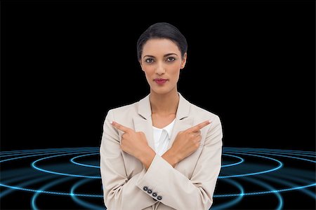 simsearch:400-07345820,k - Composite image of charismatic businesswoman with her arms crossed and fingers pointing Stock Photo - Budget Royalty-Free & Subscription, Code: 400-07188808