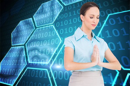 simsearch:400-07189587,k - Composite image of peaceful young businesswoman praying while posing Stockbilder - Microstock & Abonnement, Bildnummer: 400-07188830