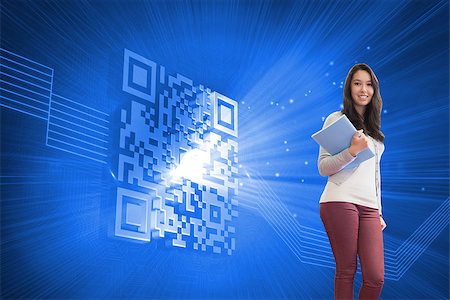simsearch:400-07189587,k - Composite image of student standing in a computer room and holding a folder while smiling Stockbilder - Microstock & Abonnement, Bildnummer: 400-07189049