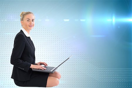 simsearch:400-07188518,k - Composite image of blonde businesswoman using laptop Foto de stock - Royalty-Free Super Valor e Assinatura, Número: 400-07189472