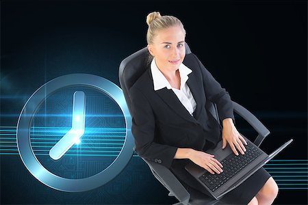 simsearch:400-07188518,k - Composite image of blonde businesswoman sitting on swivel chair with laptop Foto de stock - Royalty-Free Super Valor e Assinatura, Número: 400-07189488