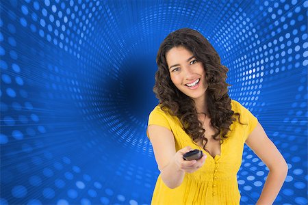 simsearch:400-07345820,k - Composite image of smiling curly haired pretty woman changing channel with remote Stock Photo - Budget Royalty-Free & Subscription, Code: 400-07189548