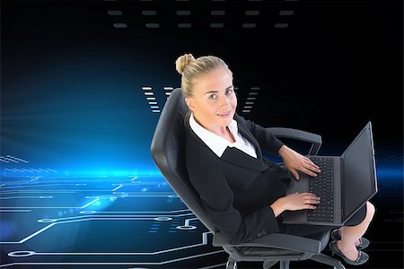 simsearch:400-07188518,k - Composite image of blonde businesswoman sitting on swivel chair with laptop Foto de stock - Royalty-Free Super Valor e Assinatura, Número: 400-07189769