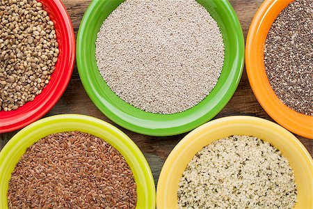 white and black chia, flax and hemp seeds in colorful ceramic bowls Photographie de stock - Aubaine LD & Abonnement, Code: 400-07180028