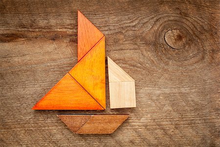 simsearch:400-07774007,k - abstract picture of a sailing boat built from seven tangram wooden pieces over a rustic  barn wood, artwork created by the photographer Foto de stock - Royalty-Free Super Valor e Assinatura, Número: 400-07180030