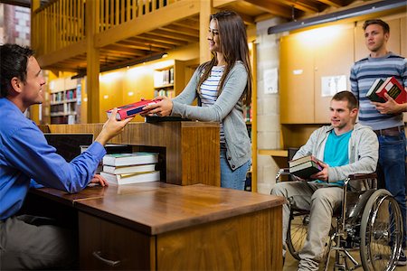 disabled female student - Students with handicapped man in row at the counter in college library Stock Photo - Budget Royalty-Free & Subscription, Code: 400-07180797