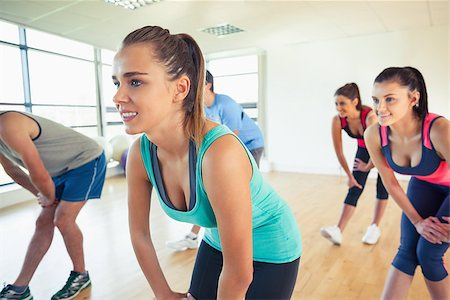 Fitness class and instructor doing power fitness exercise in fitness studio Stock Photo - Budget Royalty-Free & Subscription, Code: 400-07181283