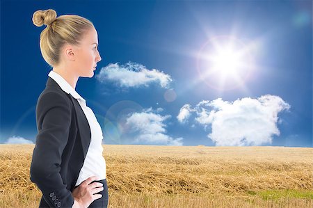 Composite image of blonde businesswoman standing with hands on hips Photographie de stock - Aubaine LD & Abonnement, Code: 400-07190971