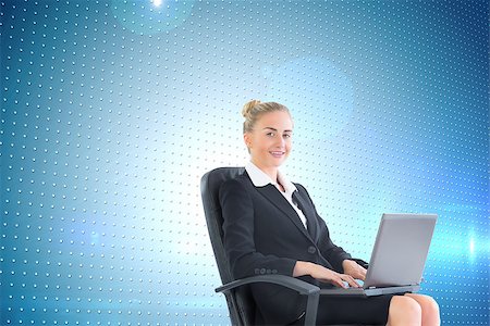 simsearch:400-07188518,k - Composite image of attractive blonde businesswoman sitting in swivel chair with laptop Foto de stock - Royalty-Free Super Valor e Assinatura, Número: 400-07191928