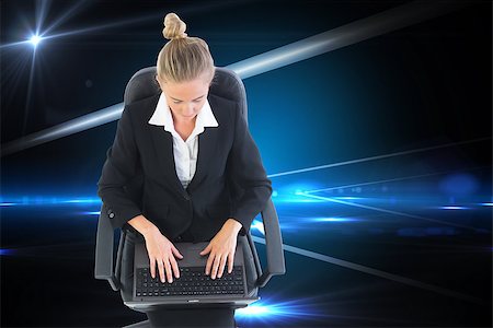 simsearch:400-07188518,k - Composite image of blonde businesswoman sitting on swivel chair with laptop Foto de stock - Royalty-Free Super Valor e Assinatura, Número: 400-07191977