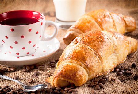 Fresh baked French croissant and dark coffee in the cup Fotografie stock - Microstock e Abbonamento, Codice: 400-07206899