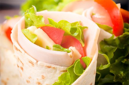 Tasty tortilla wrap with turkey meat and vegetables Stockbilder - Microstock & Abonnement, Bildnummer: 400-07206936
