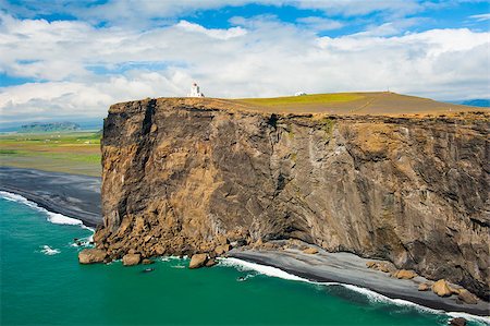 simsearch:400-04813407,k - Small lighthouse on the cliff at the cape Dyrholaey, the most southern point of Iceland. Photographie de stock - Aubaine LD & Abonnement, Code: 400-07207369