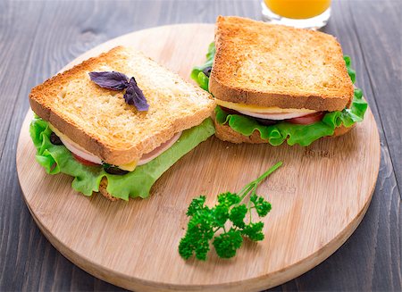 simsearch:400-07099478,k - Sandwich with ham, cheese, tomatoes and salad on toasted bread Stock Photo - Budget Royalty-Free & Subscription, Code: 400-07207998