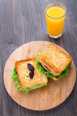 simsearch:400-07099478,k - Sandwich with ham, cheese, tomatoes and salad on toasted bread Stock Photo - Budget Royalty-Free & Subscription, Code: 400-07208000