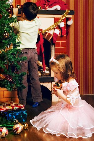 simsearch:400-07088886,k - beautiful boy and girl decorate christmas tree Stock Photo - Budget Royalty-Free & Subscription, Code: 400-07208068