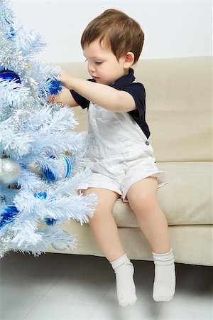simsearch:400-07088886,k - beautiful happy small kid decorate christmas tree Stock Photo - Budget Royalty-Free & Subscription, Code: 400-07208079