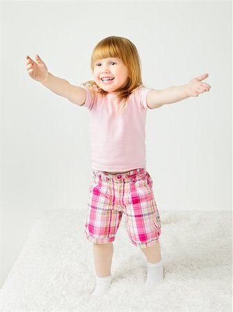 beautiful little girl playing and smilng on bed Stock Photo - Budget Royalty-Free & Subscription, Code: 400-07208138