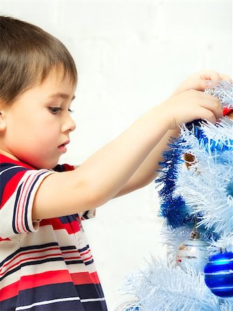 simsearch:400-07088886,k - beautiful happy small boy decorate christmas tree Stock Photo - Budget Royalty-Free & Subscription, Code: 400-07208139