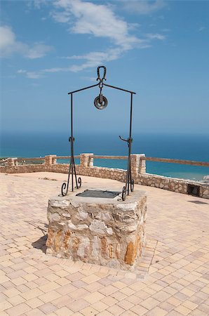 Old water well made â??â??of stone and steel in castle Stock Photo - Budget Royalty-Free & Subscription, Code: 400-07208155