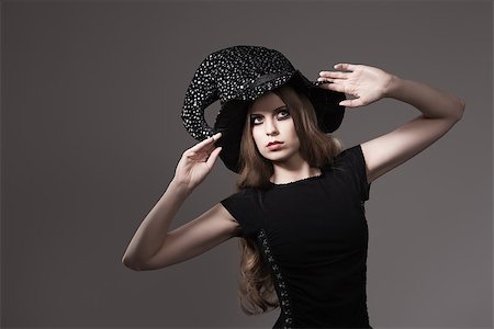 pretty girls with long dark hair - portrait of sensual blonde woman with Halloween style and creative make-up wearing witch hat and black dress Stock Photo - Budget Royalty-Free & Subscription, Code: 400-07208184