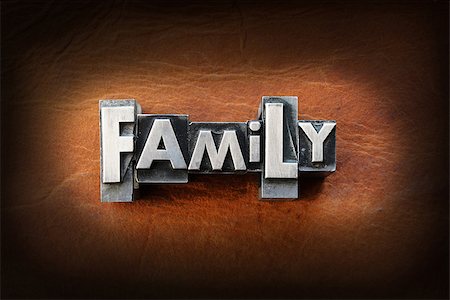 The word family made from vintage lead letterpress type on a leather background. Stock Photo - Budget Royalty-Free & Subscription, Code: 400-07208547