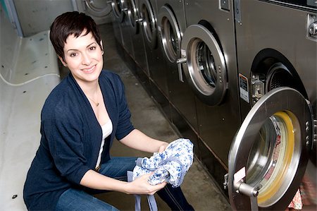 simsearch:640-02949110,k - She does laundry with a smile Stock Photo - Budget Royalty-Free & Subscription, Code: 400-07208677