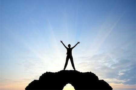 simsearch:400-08035788,k - woman on a mountain top his arms in hand against the sunny sky Fotografie stock - Microstock e Abbonamento, Codice: 400-07208696