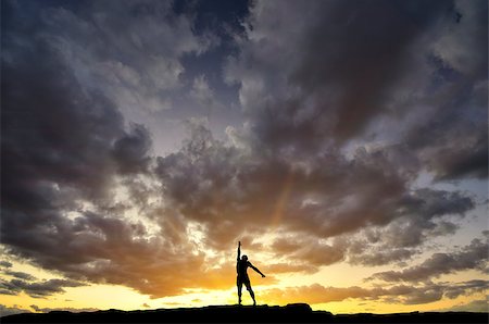 simsearch:400-04043242,k - man on top of the mountain reaches for the sun Photographie de stock - Aubaine LD & Abonnement, Code: 400-07208704